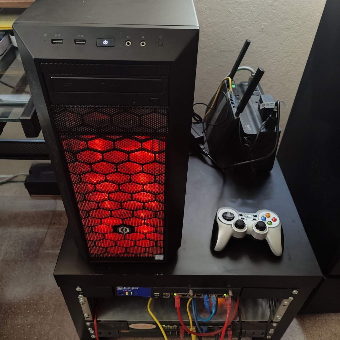 A plain black tower PC.  Red glowing fans in front.